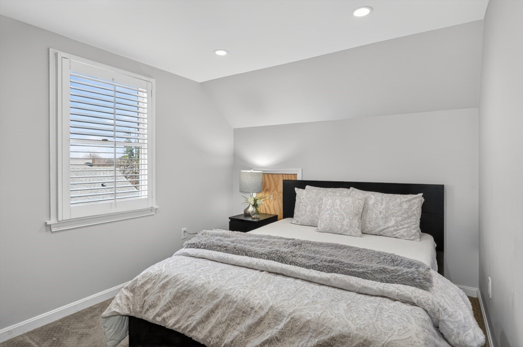 23 Stearns Road Belmont, MA 02478 - Photo 32 of 42 a bedroom with a bed and a window
