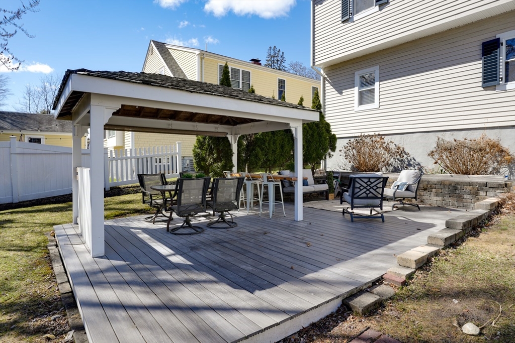 23 Stearns Road Belmont, MA 02478 - Photo 42 of 42 a view of a patio with table and chairs near a barbeque