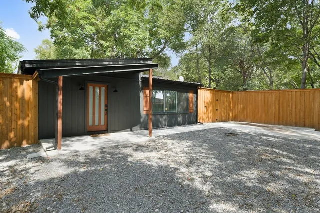 a house with trees in the background