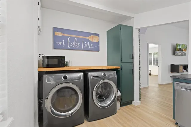 a view of a hallway with washer and dryer