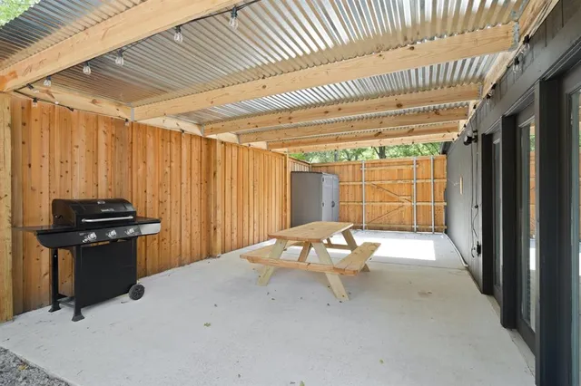 a view of a room with table and chairs