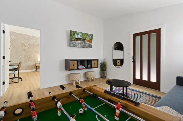 a living room with furniture and a table