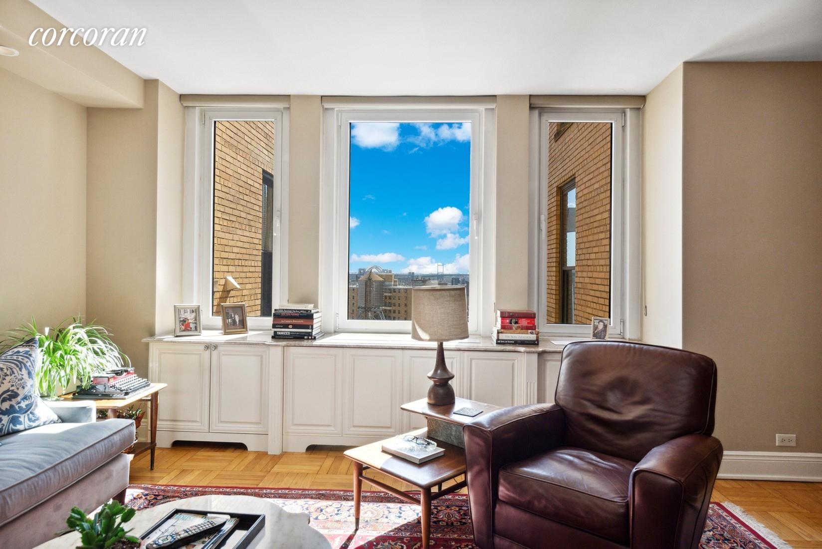 1215 5th Avenue, Unit 15D Manhattan, NY 10029 - Photo 1 of 10 a living room with furniture and a large window