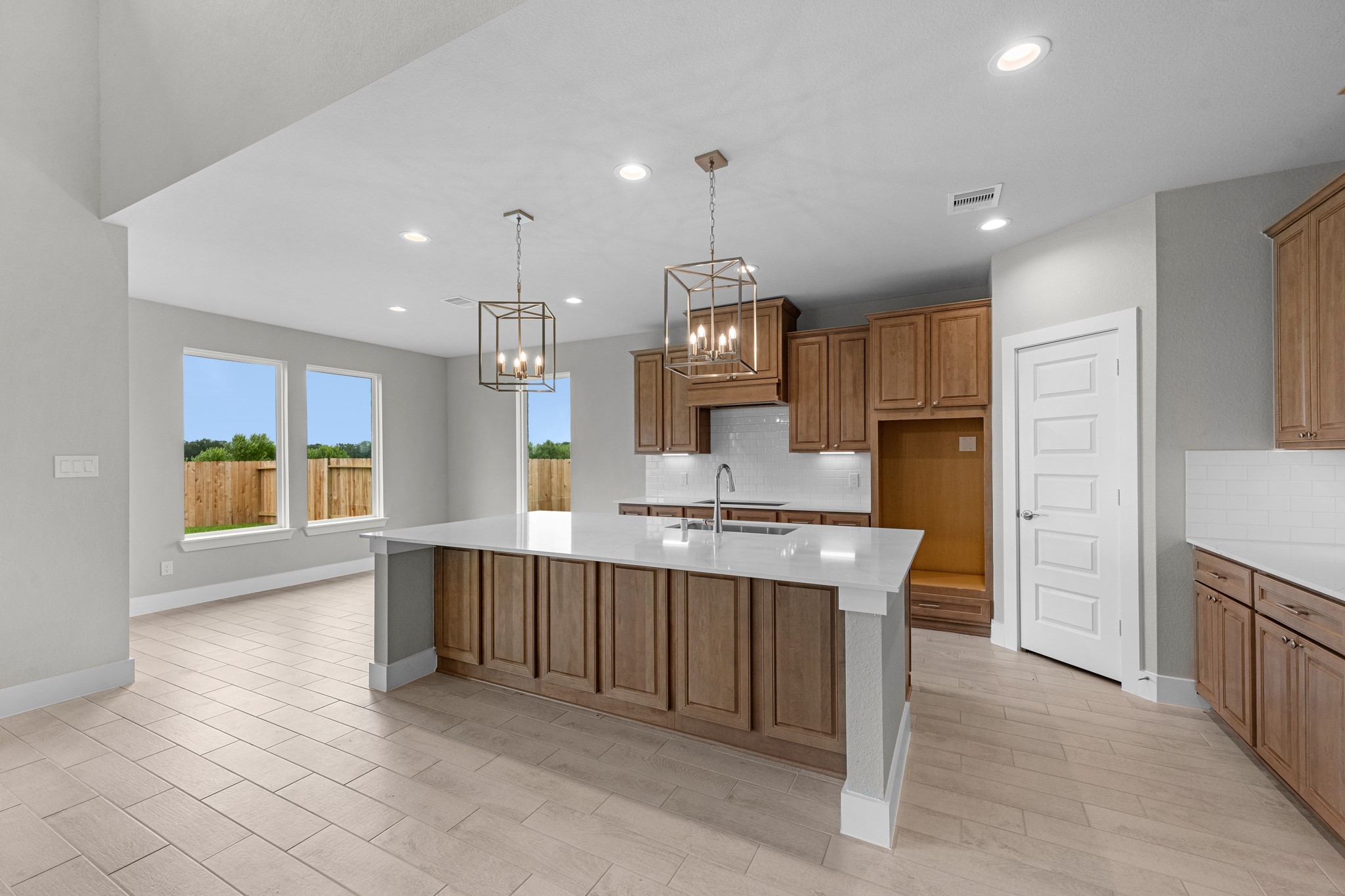 3410 Everglade Lane Rosenberg, TX 77471 - Photo 4 of 39 a large kitchen with cabinets and stainless steel appliances