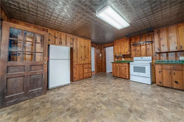 an empty room with furniture and a fireplace