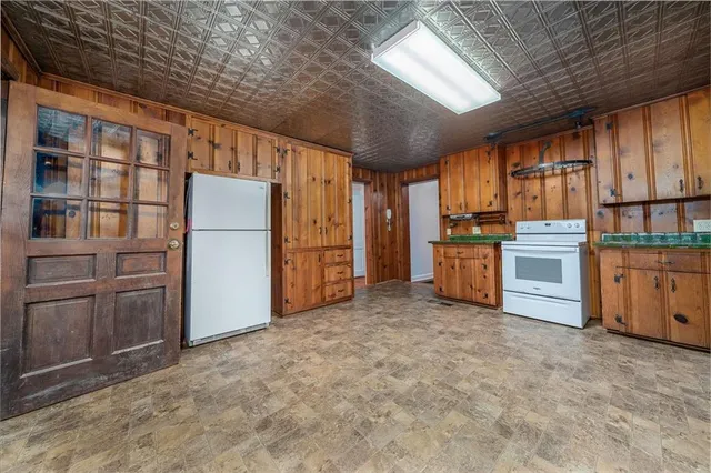 an empty room with furniture and a fireplace