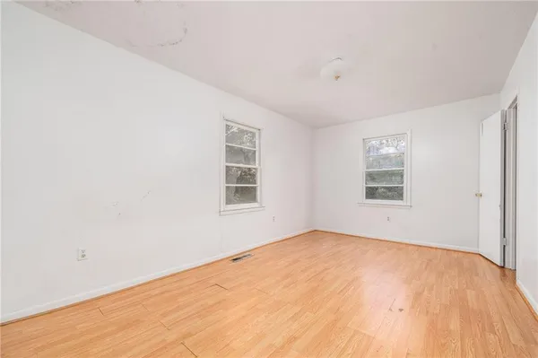 an empty room with windows