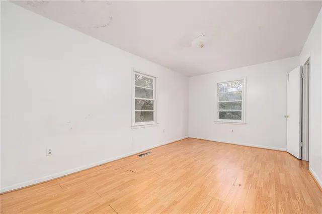 an empty room with windows