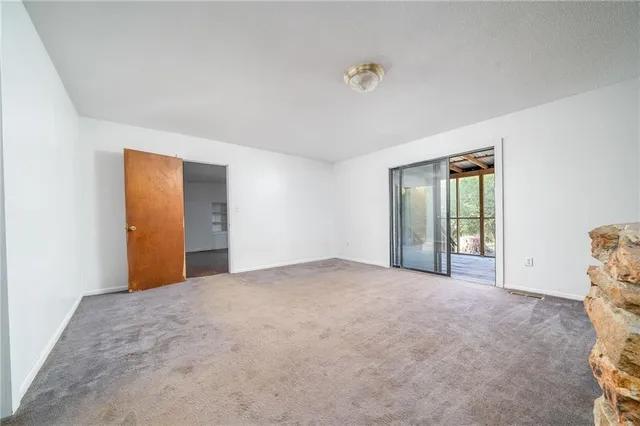 a view of an empty room with a large window