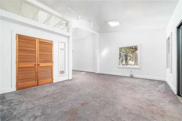 a house with trees in the background