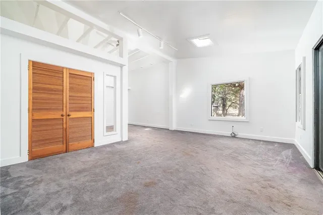 a house with trees in the background