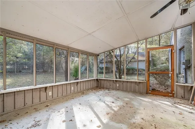 a view of balcony with furniture and wooden floor