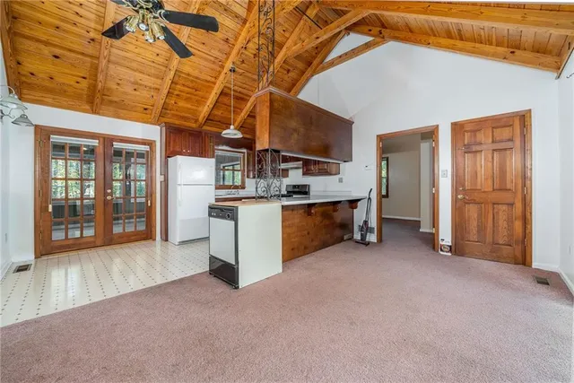a view of a field with trees in background