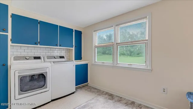 a view of a kitchen with washer and dryer