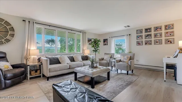 a living room with furniture and a large window