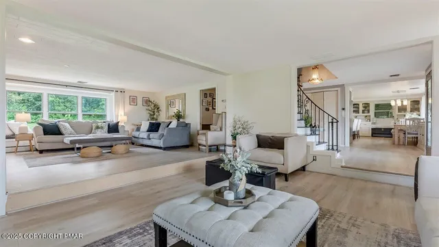 a living room with furniture and a table
