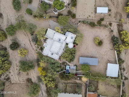 an aerial view of a house with outdoor space