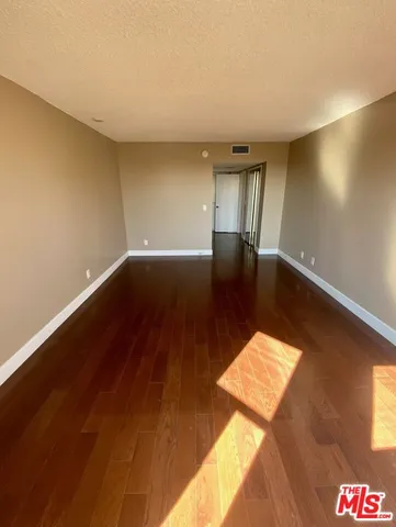 a spacious bathroom with a mirror sink and vanity