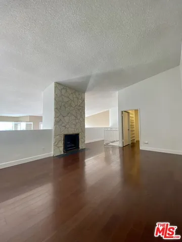 a view of a livingroom with wooden floor