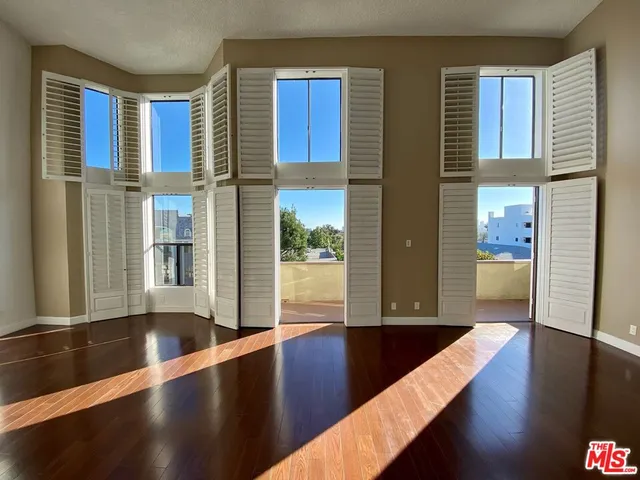 a view of a living room with a large window