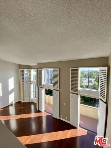 a kitchen with granite countertop stainless steel appliances and wooden cabinets