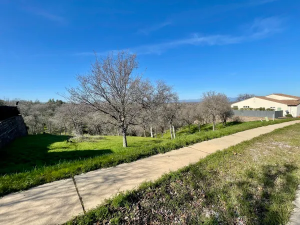 a view of a road with a yard