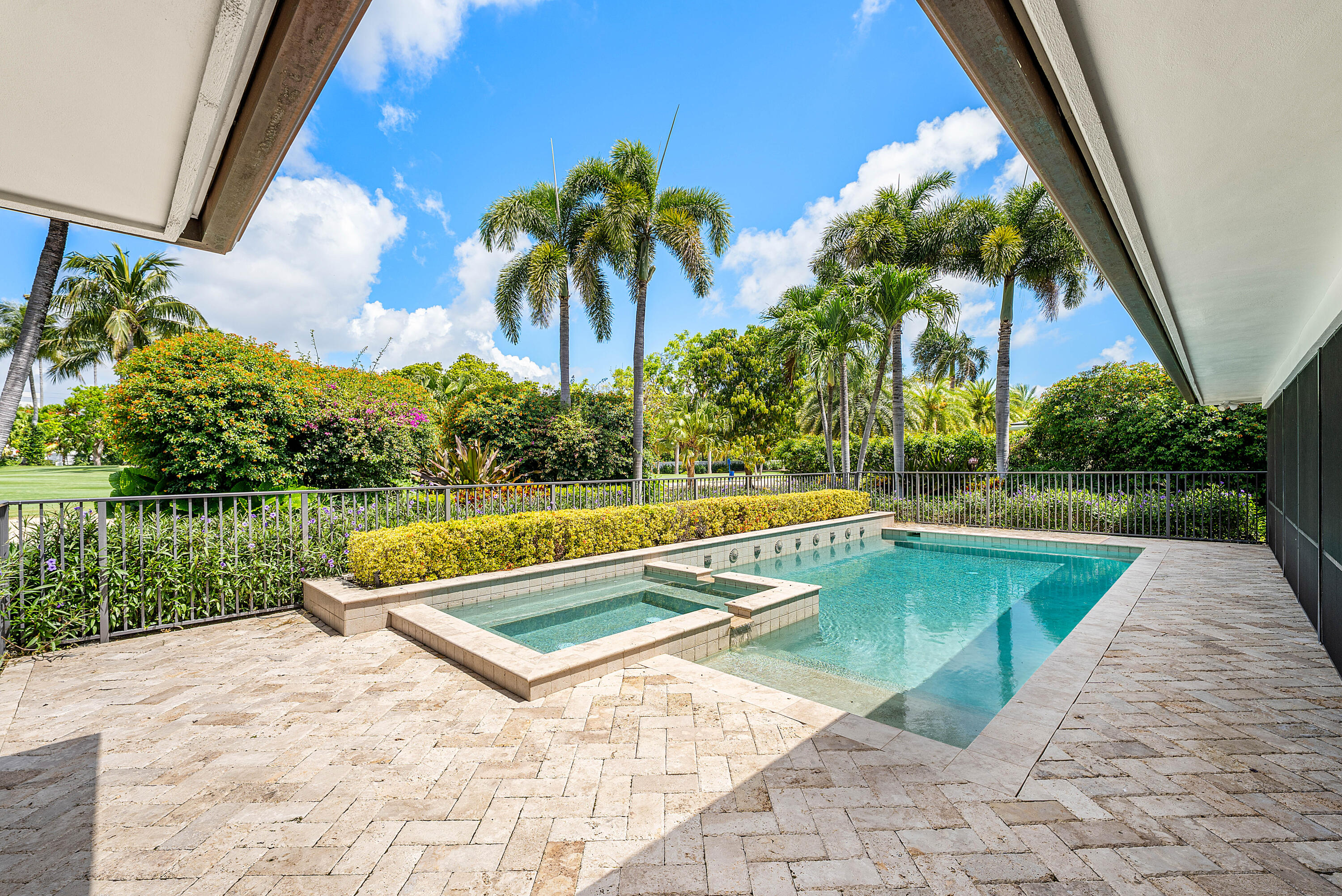 1851 Thatch Palm Drive Boca Raton, FL 33432 - Photo 49 of 70 a view of swimming pool with a garden and a patio