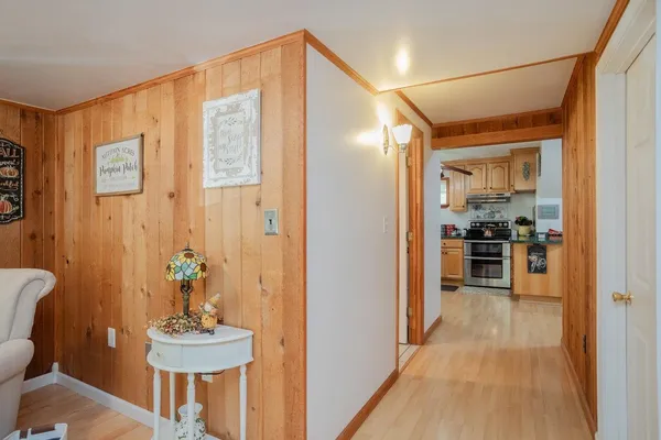 a kitchen with stainless steel appliances granite countertop a sink a stove and cabinets