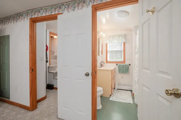 a view of a room with closet and windows