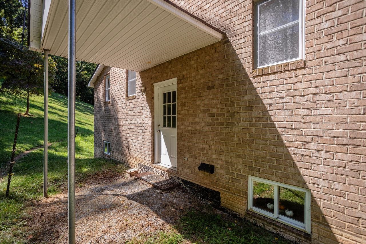 279 Helms Road Stanley, VA 22851 - Photo 44 of 64 a brick building with a large window