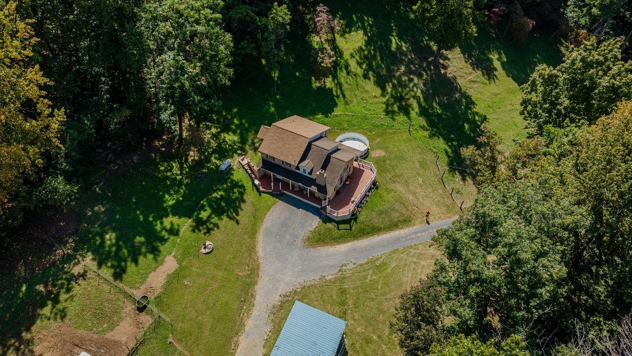 279 Helms Road Stanley, VA 22851 - Photo 59 of 64 an aerial view of a house with a yard