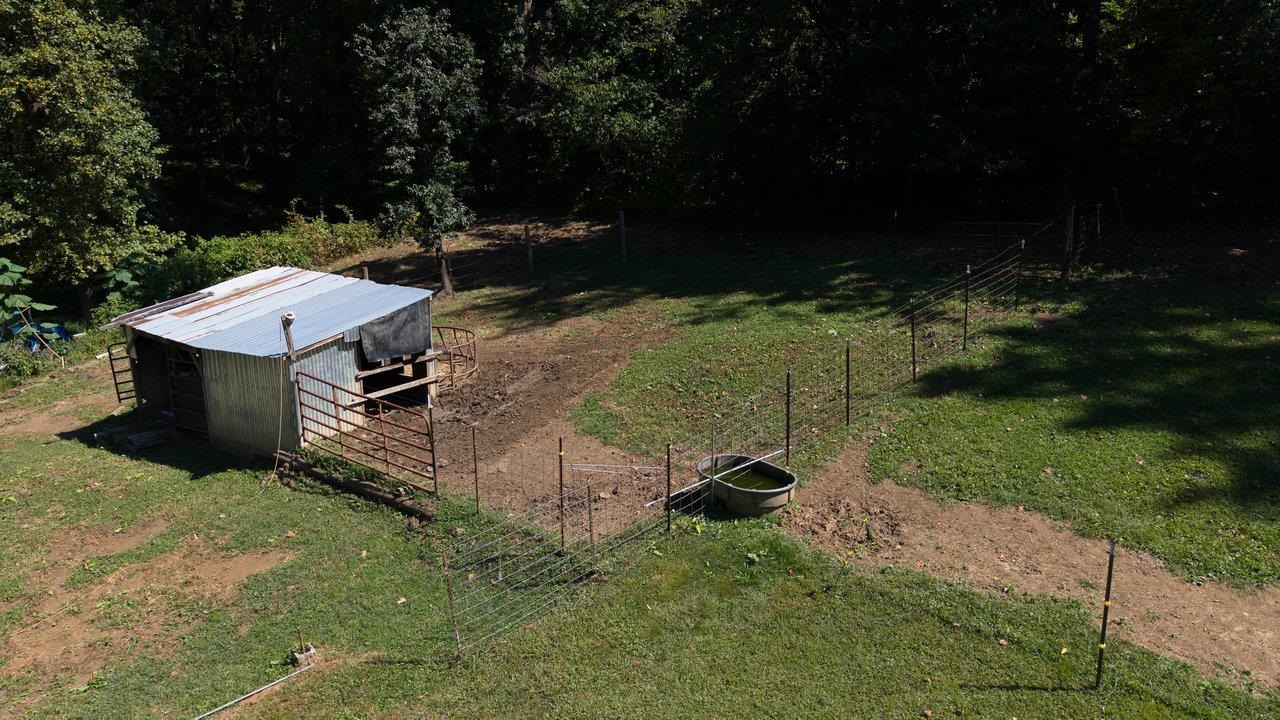 279 Helms Road Stanley, VA 22851 - Photo 64 of 64 a view of a backyard with a garden