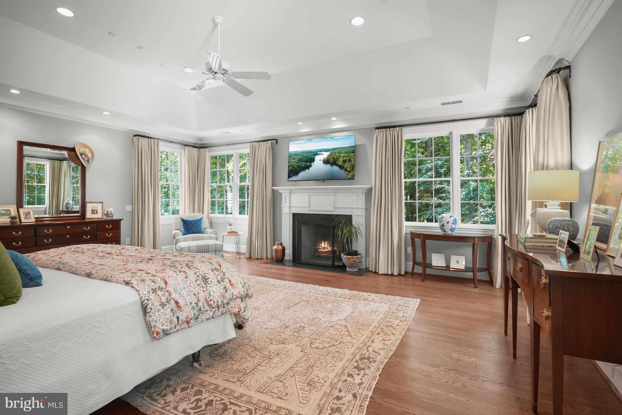 9908 Newhall Road Potomac, MD 20854 - Photo 19 of 44 Primary Bedroom with Fireplace and Lush Views