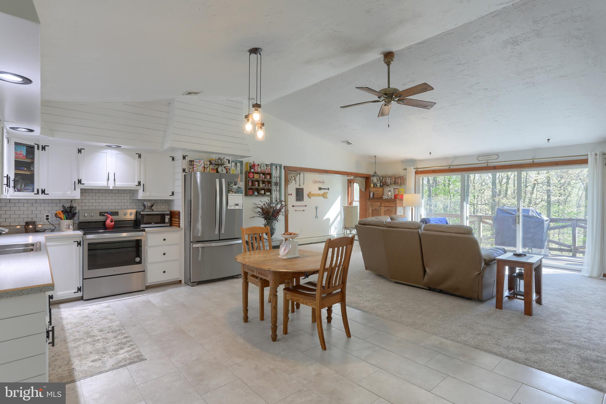 10 Bullfrog Road Grantville, PA 17028 - Photo 13 of 51 a view of a dining room with furniture window and outside view