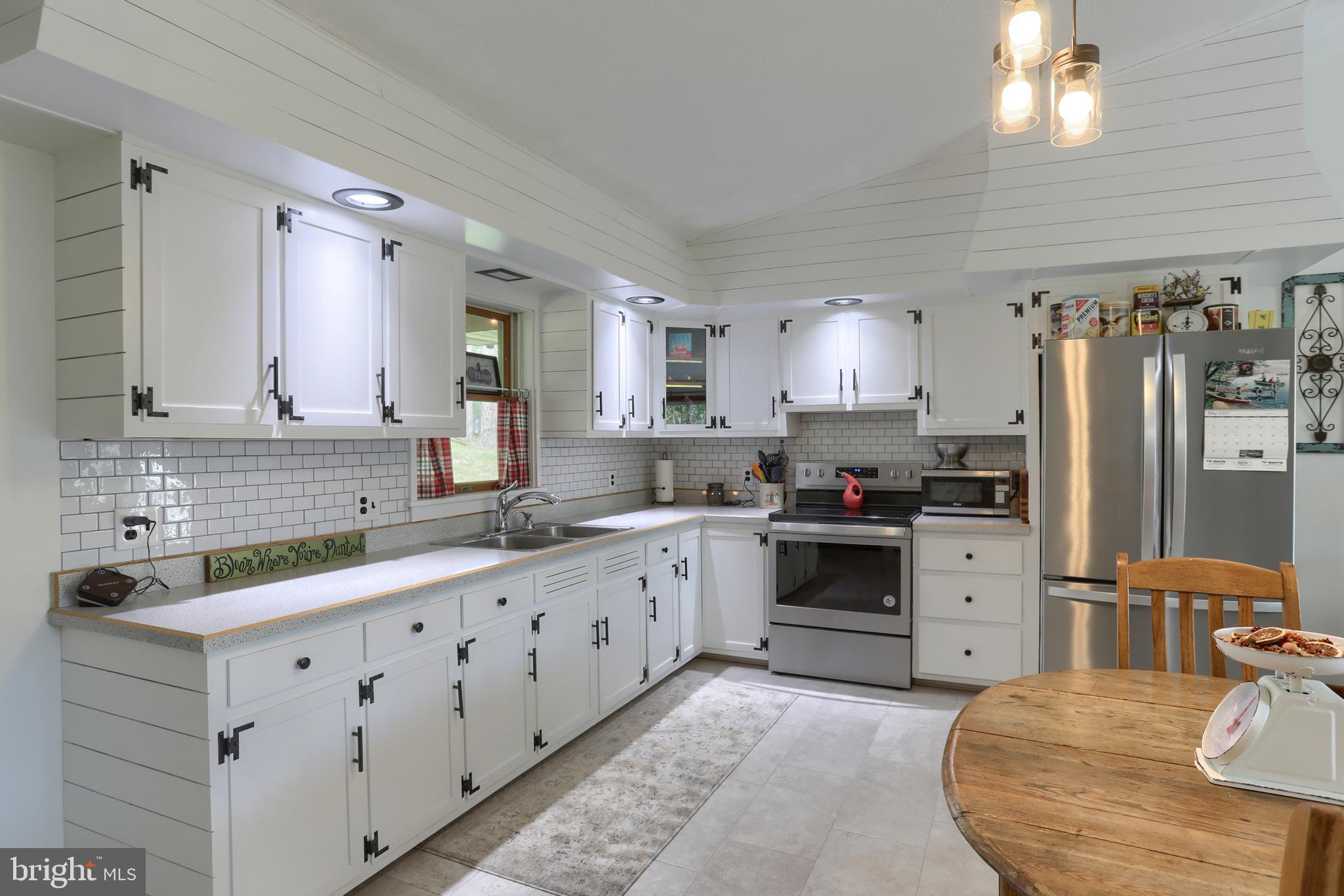 10 Bullfrog Road Grantville, PA 17028 - Photo 14 of 51 a large kitchen with kitchen island a sink stainless steel appliances and cabinets