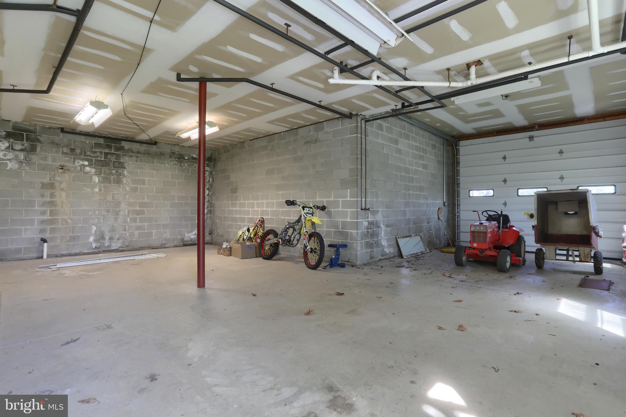 10 Bullfrog Road Grantville, PA 17028 - Photo 43 of 51 a view of a garage with a table and chairs