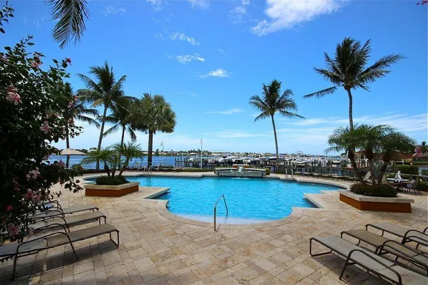 a view of a swimming pool and lounge chair