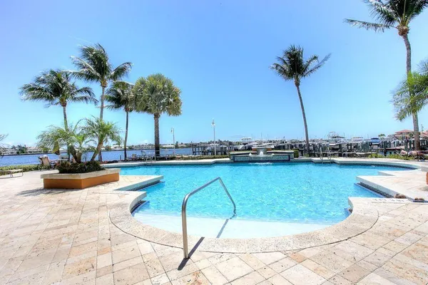 a view of a swimming pool and a chair