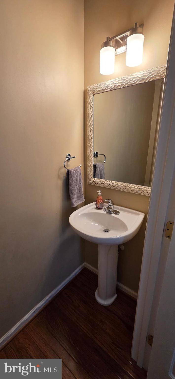 25366 Vacation Place Aldie, VA 20105 - Photo 13 of 51 a bathroom with a sink a mirror and toilet