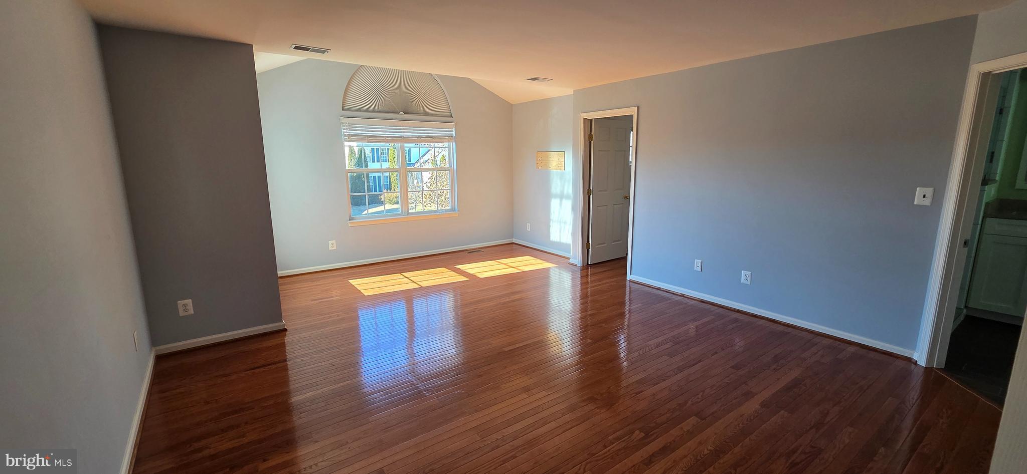 25366 Vacation Place Aldie, VA 20105 - Photo 15 of 51 an empty room with wooden floor and windows