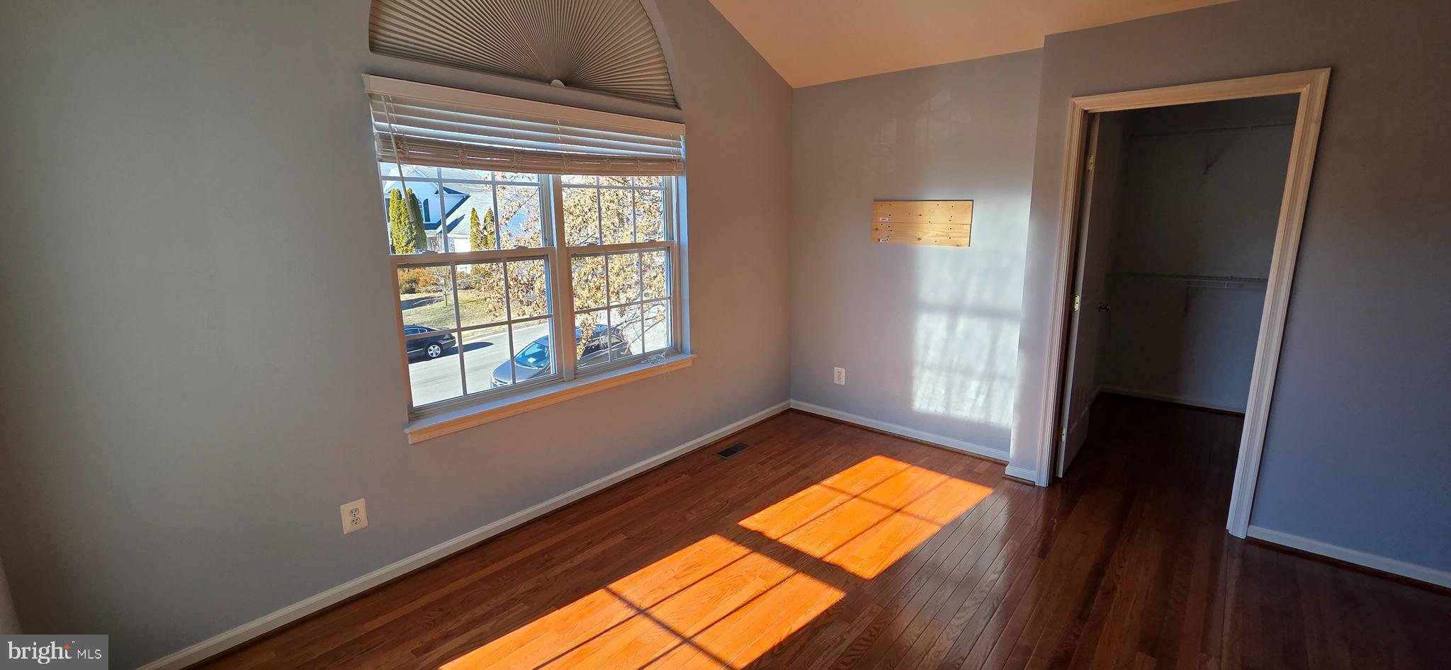 25366 Vacation Place Aldie, VA 20105 - Photo 18 of 51 a view of empty room with a window and wooden floor