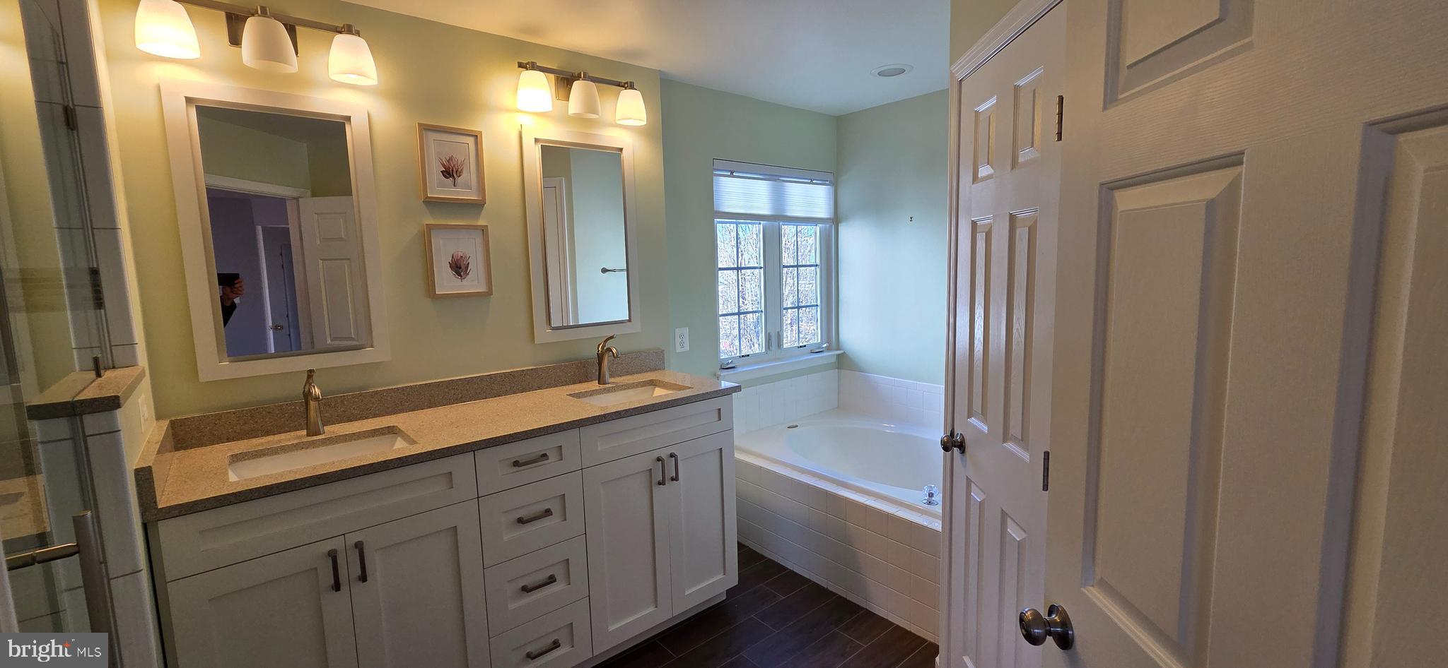 25366 Vacation Place Aldie, VA 20105 - Photo 21 of 51 a bathroom with double vanity sinks and a mirror
