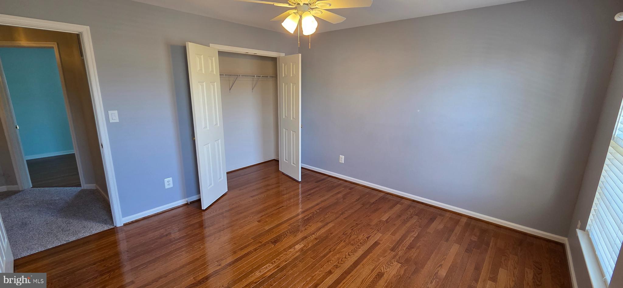 25366 Vacation Place Aldie, VA 20105 - Photo 27 of 51 an empty room with wooden floor and door