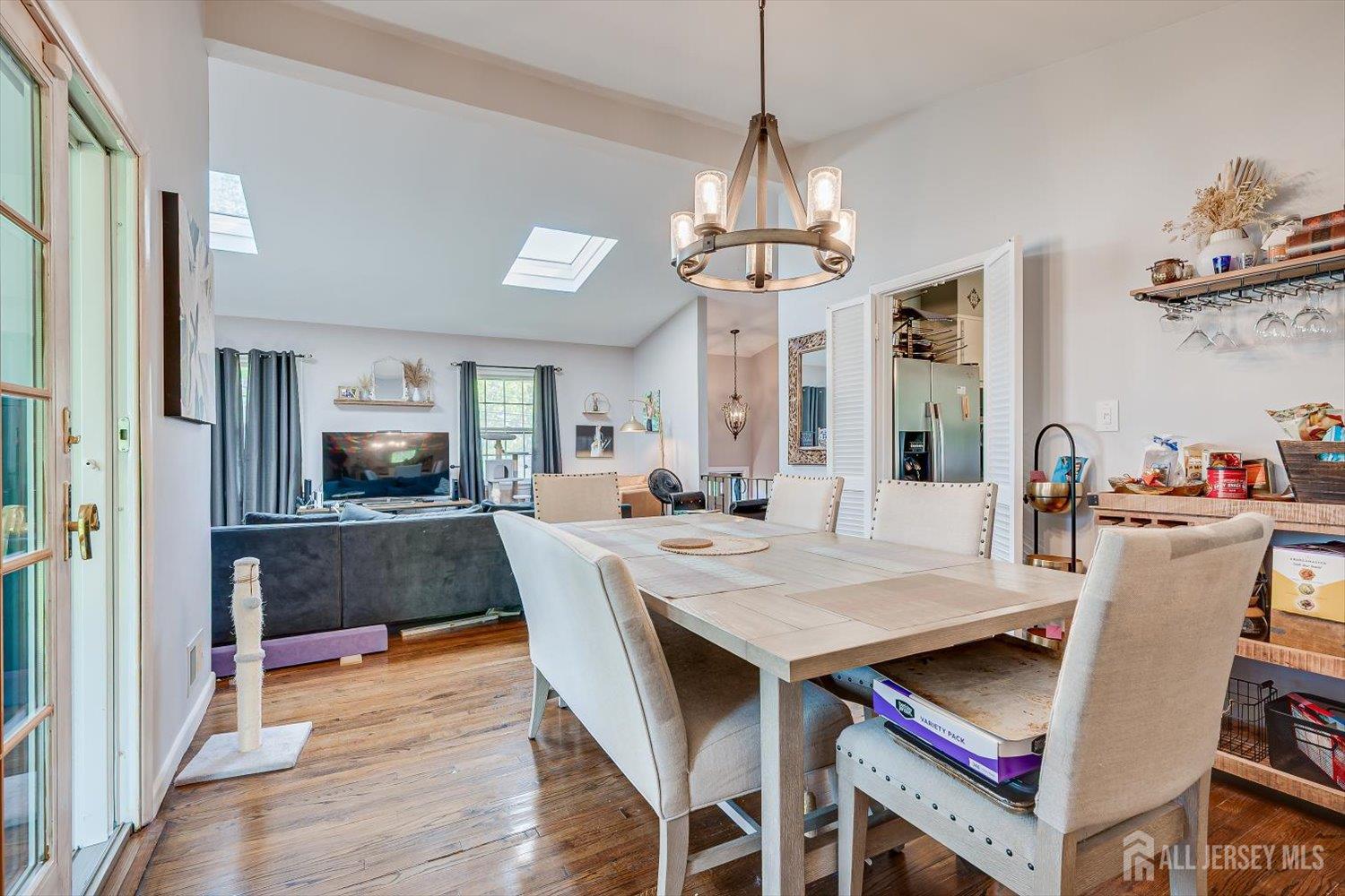 12 Gales Road Edison, NJ 08837 - Photo 10 of 35 a view of a dining room with furniture a chandelier and wooden floor