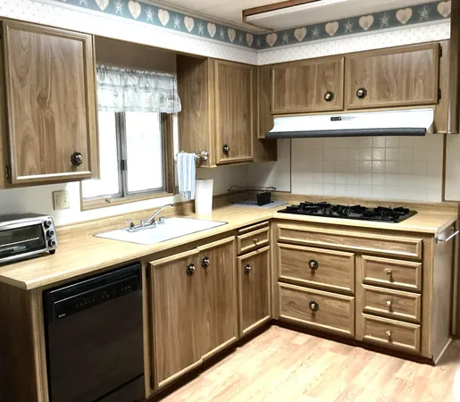 a kitchen with a stove and a sink