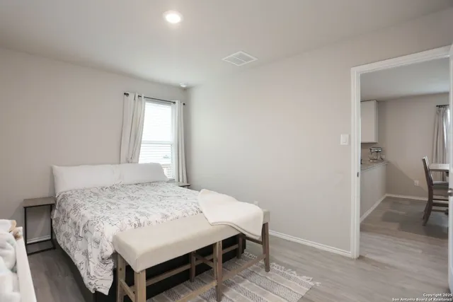 a bedroom with a bed and a table in it