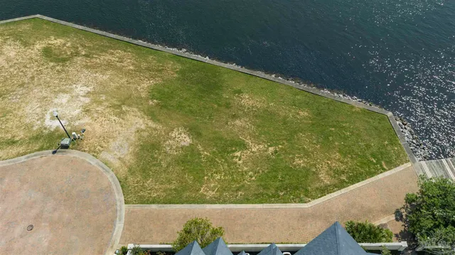 a view of swimming pool from a balcony