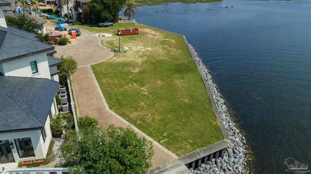 a view of a swimming pool with a yard
