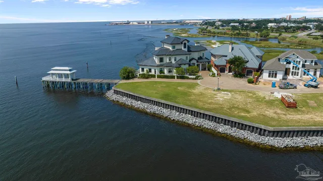 a view of a swimming pool with lawn chairs