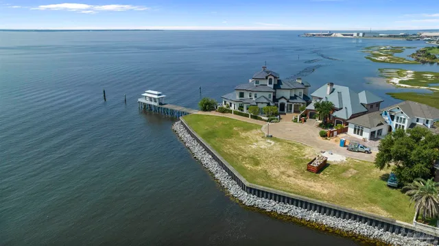 an aerial view of a house with outdoor space